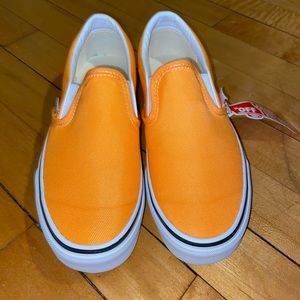Neon orange slip on vans